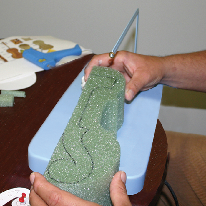cutting foam with pattern drawn on foam
