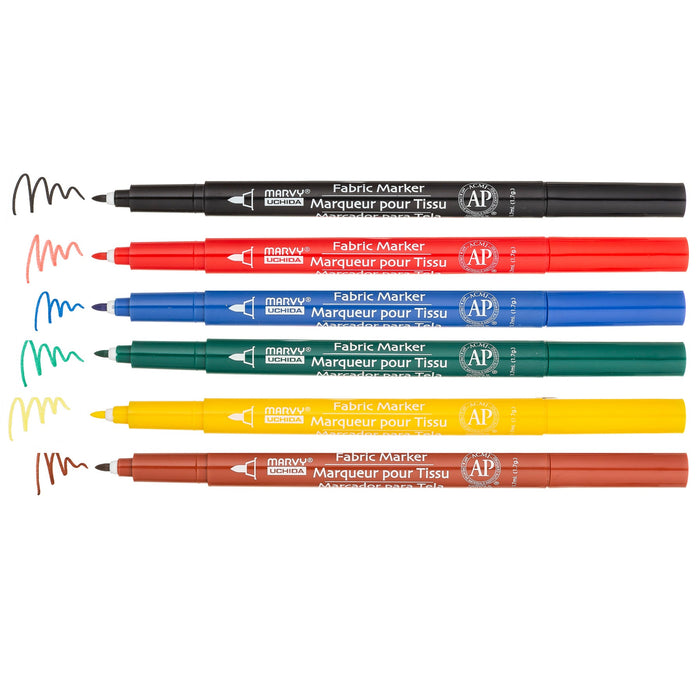Shoe decor fabric marker primary set markers with the cap off showing color squiggles at the tips. Black, red, blue, green, yellow and brown.
