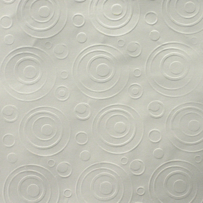 A paper sample with bubbles pattern crimped on it