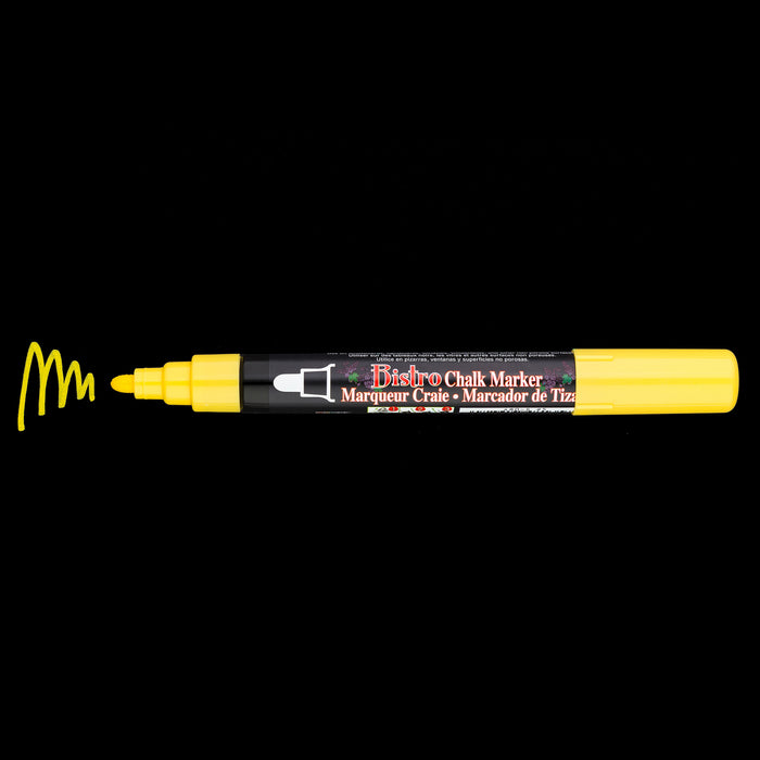 Bistro chalk broad tip yellow with cap off showing ink color on a black background.