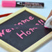 Erasing chalk marker with a damp cloth.